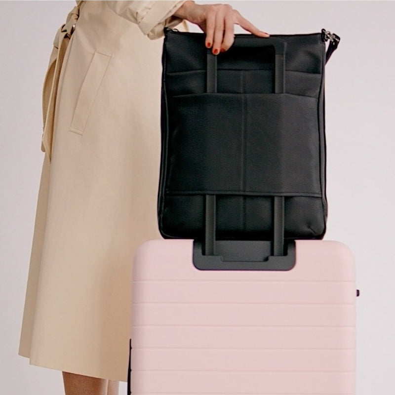 Features a luggage sleeve for easy airport portability, with a French seam detail.